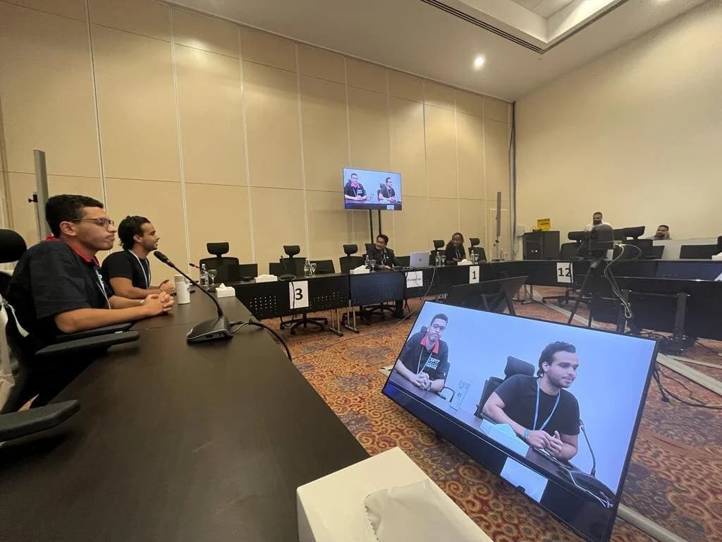 Ibrahim ( Ibra ) Gamal speaking on stage during presentation at climate conference